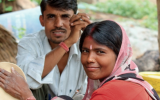 Evidence project – Population Council image of a woman and a man smiling