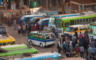 A bus stop in the early morning, Ethiopia. – Population Council many buses on a busy street in Ethiopia