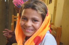 Image of a young girl with a head covering