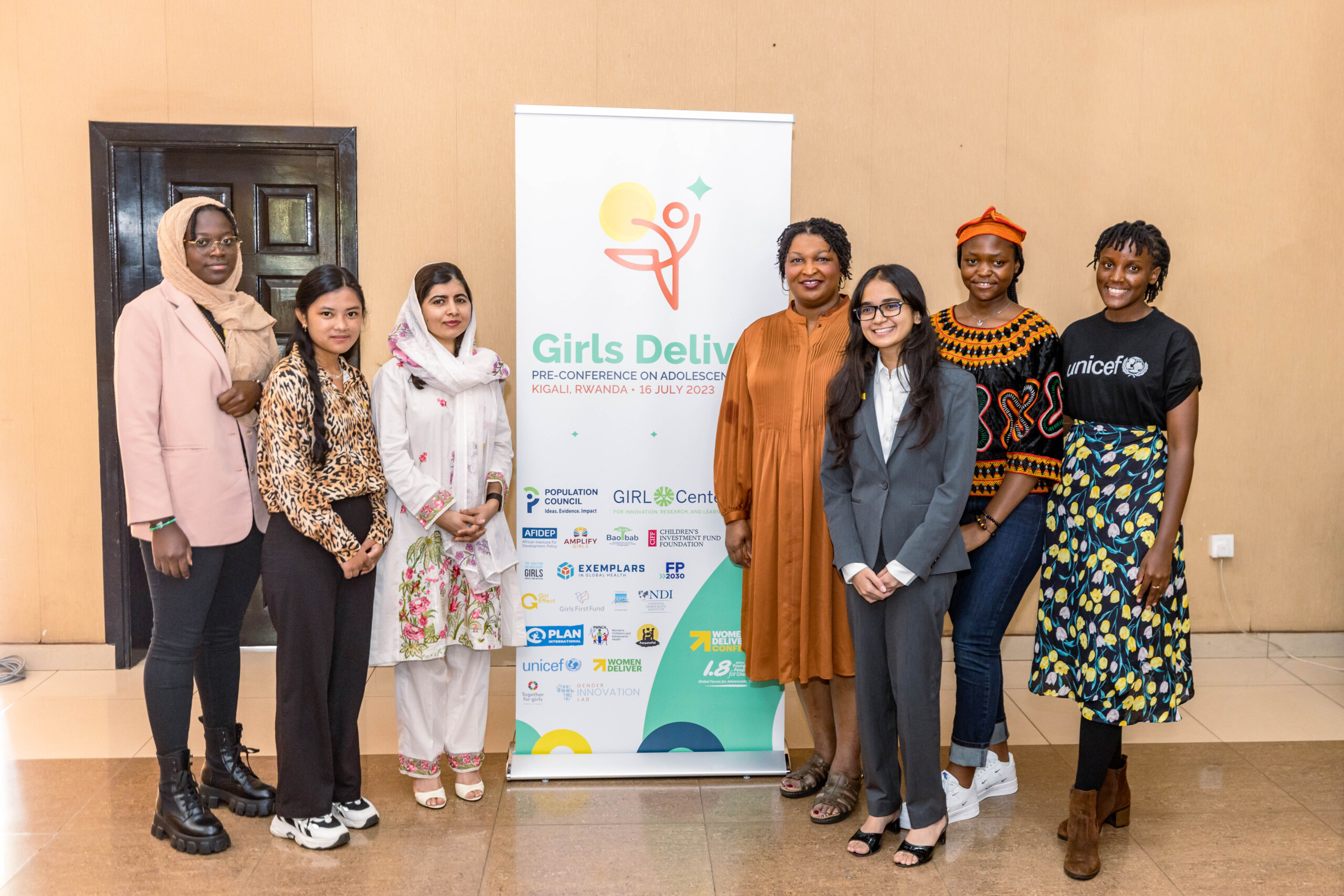 From L-R: Divina Maloum, Lalita Tamang, Malala Yousafzai, Stacey Abrams, Kalpa Garg, Condolizzarice Akumawah, and Vanessa Nakate meet ahead of starting the day with Girls Deliver. 