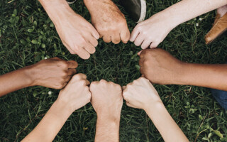 Diverse community with hands in a circle – Population Council FHF Project - Diverse community with hands in a circle