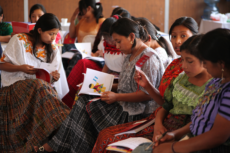 Group of indigenous girls and adolescents reading books